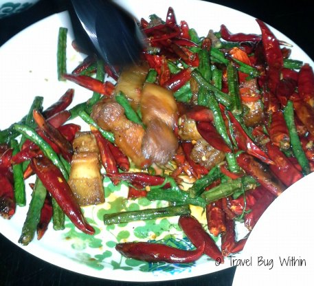 The Spice Temple's Hunan Style Crisp pork Belly with mushroom and just a "few" dried and fresh chillies.