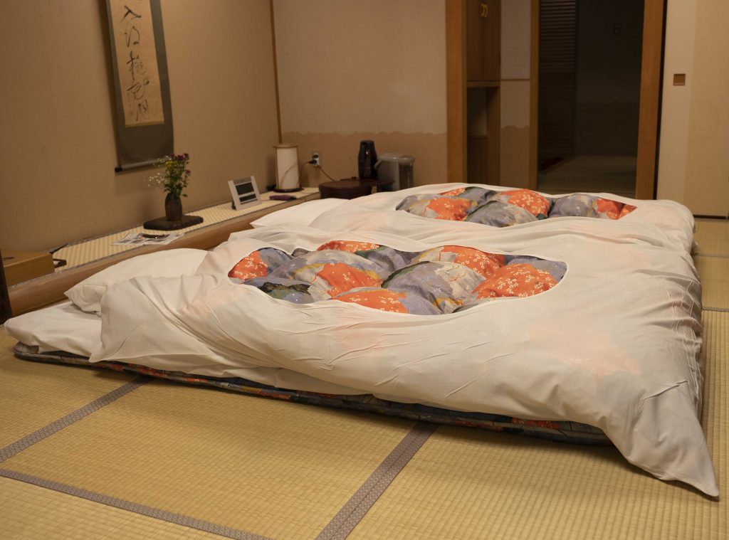 Image of two Japanese futon style beds on a tatami mat