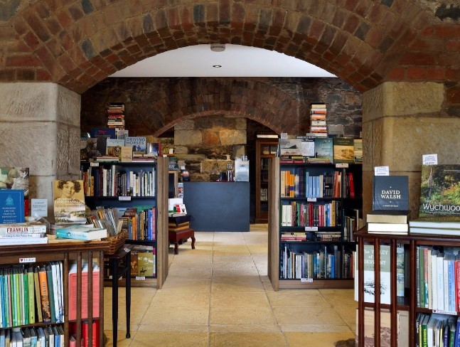 Image showing a bookstore inside an older building with stone arches
