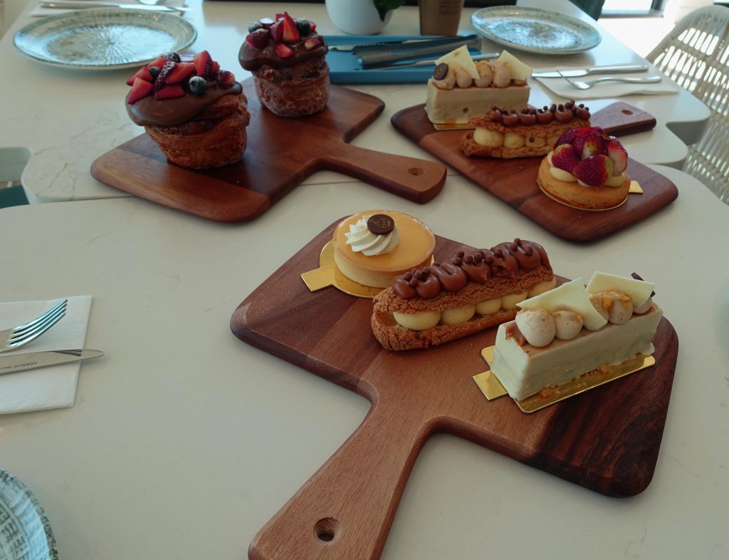 Image of wooden trays with pastry treats on a table